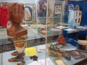 Photo 7: Picture of museum cabinet. Between the 1950s and 1970s, many Greenlandic children with mental and intellectual disabilities had been placed in Danish institutions, the majority of them in Andersvænge. Clothes, artwork and personal mementoes are now on display in the museum.